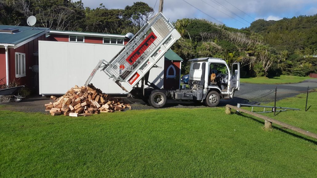 Ignition truck unloading firewood at a home